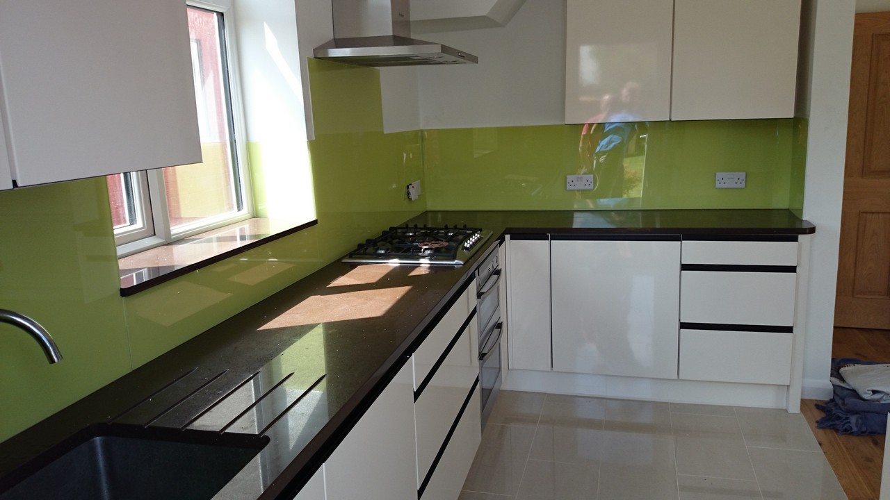 Lime green glass kitchen splashback installed by Surbiton glaziers