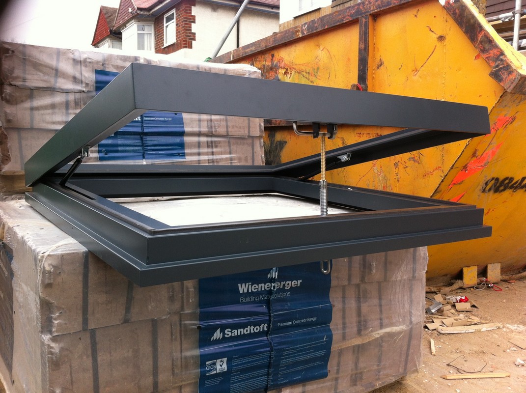 Opening flat roof skylight in anthracite grey installed in Surbiton